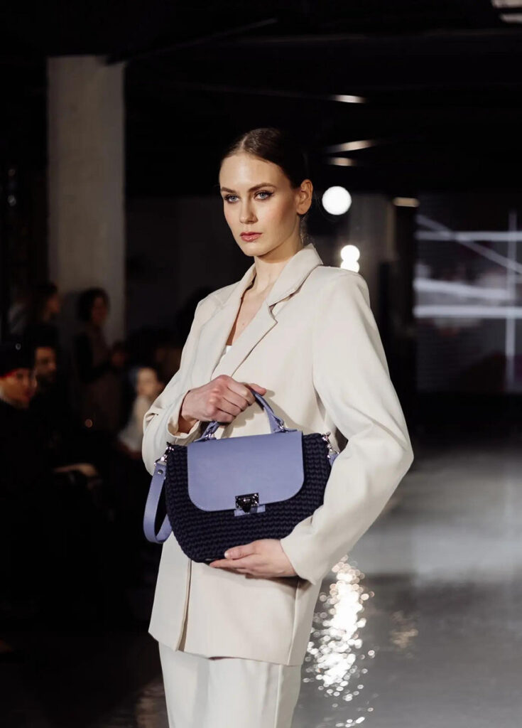 Designer Zinaida Serova with her signature handmade bags